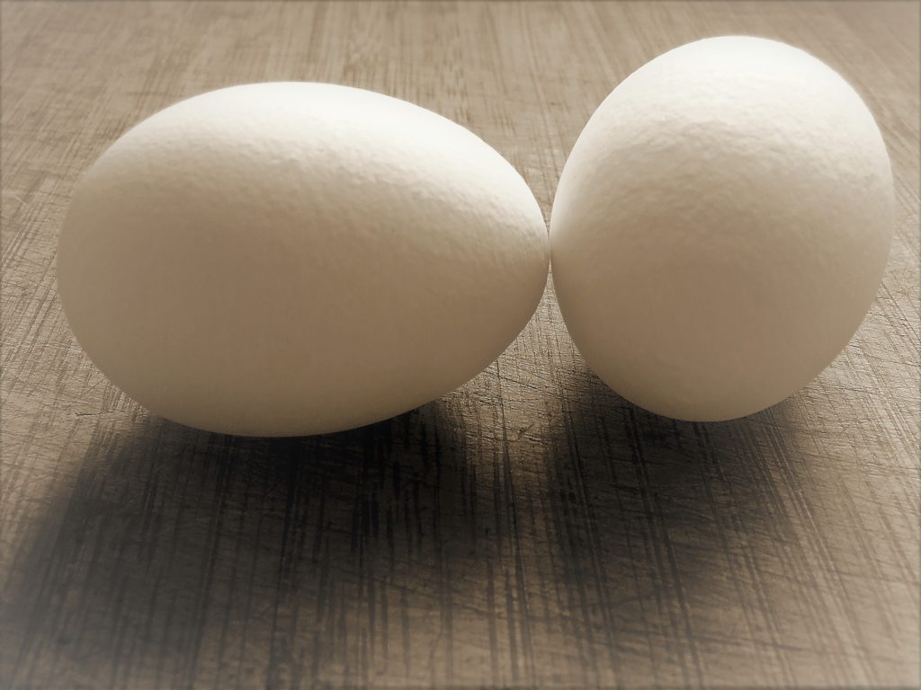 two eggs sitting on a table